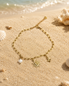 Bracelet de cheville acier inoxydable doré – charms soleil, étoile et trèfle blanc