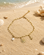 Bracelet de cheville acier inoxydable doré – charms soleil, étoile et trèfle blanc
