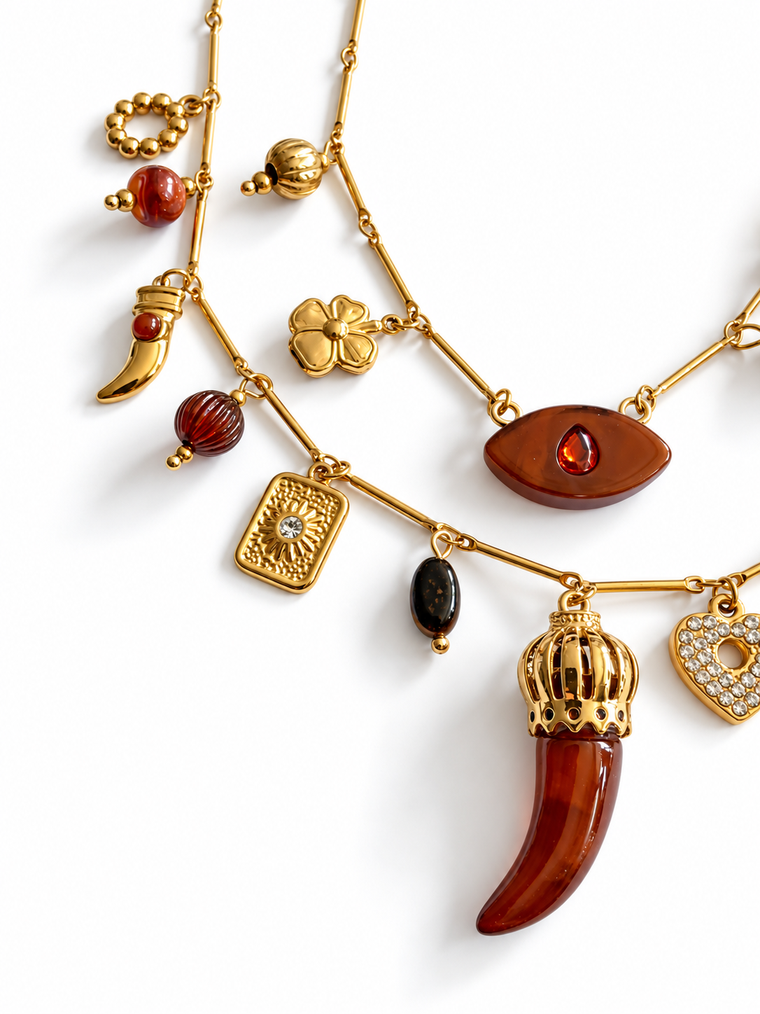 Collier double rang doré à breloques et pendentif corne brun