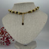 Verstelbare goudkleurige ketting met symbolische bedeltjes – Barok & talisman stijl.