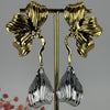 Edelstahl-Blumenohrringe – Goldenes Blumendesign mit silbernen Troddeln