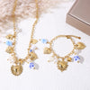 Collier charms cœurs dorés perles céramique bleue – acier inoxydable