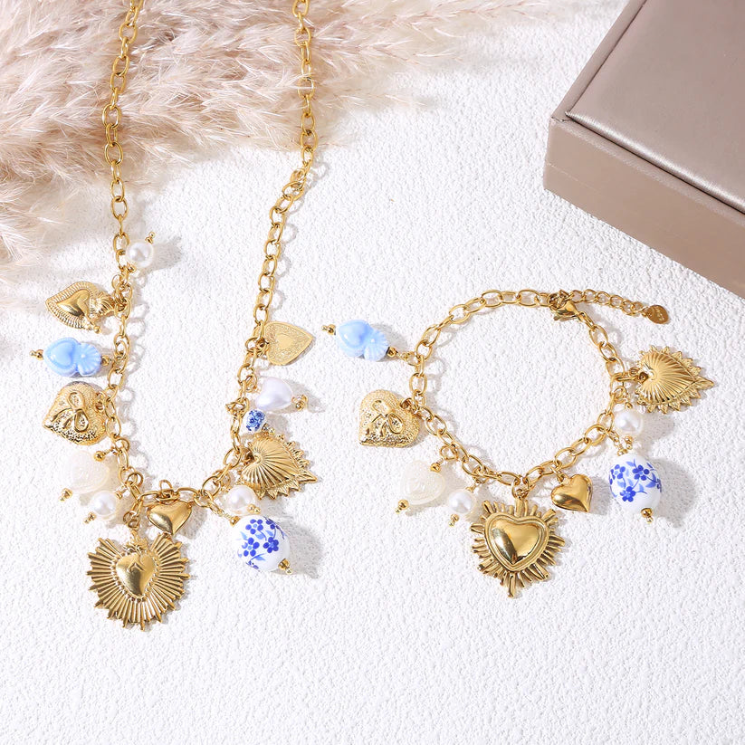 Collier charms cœurs dorés perles céramique bleue – acier inoxydable