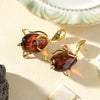 Boucles d’oreilles pendantes dorées à grande perle ambrée – 5 cm