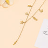 Collier Y charms marins doré en acier inoxydable
