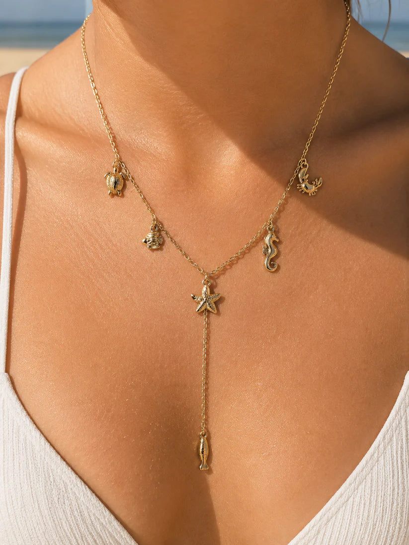 Collier Y charms marins doré en acier inoxydable