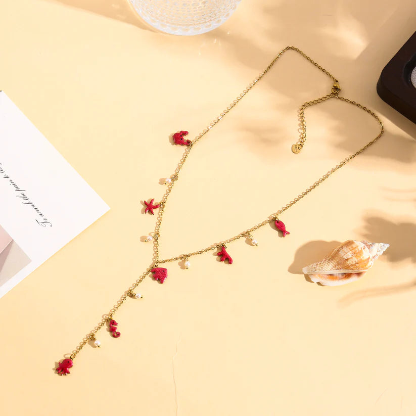 Collier Sautoir doré en Y à breloques fleurs et marines émaillé