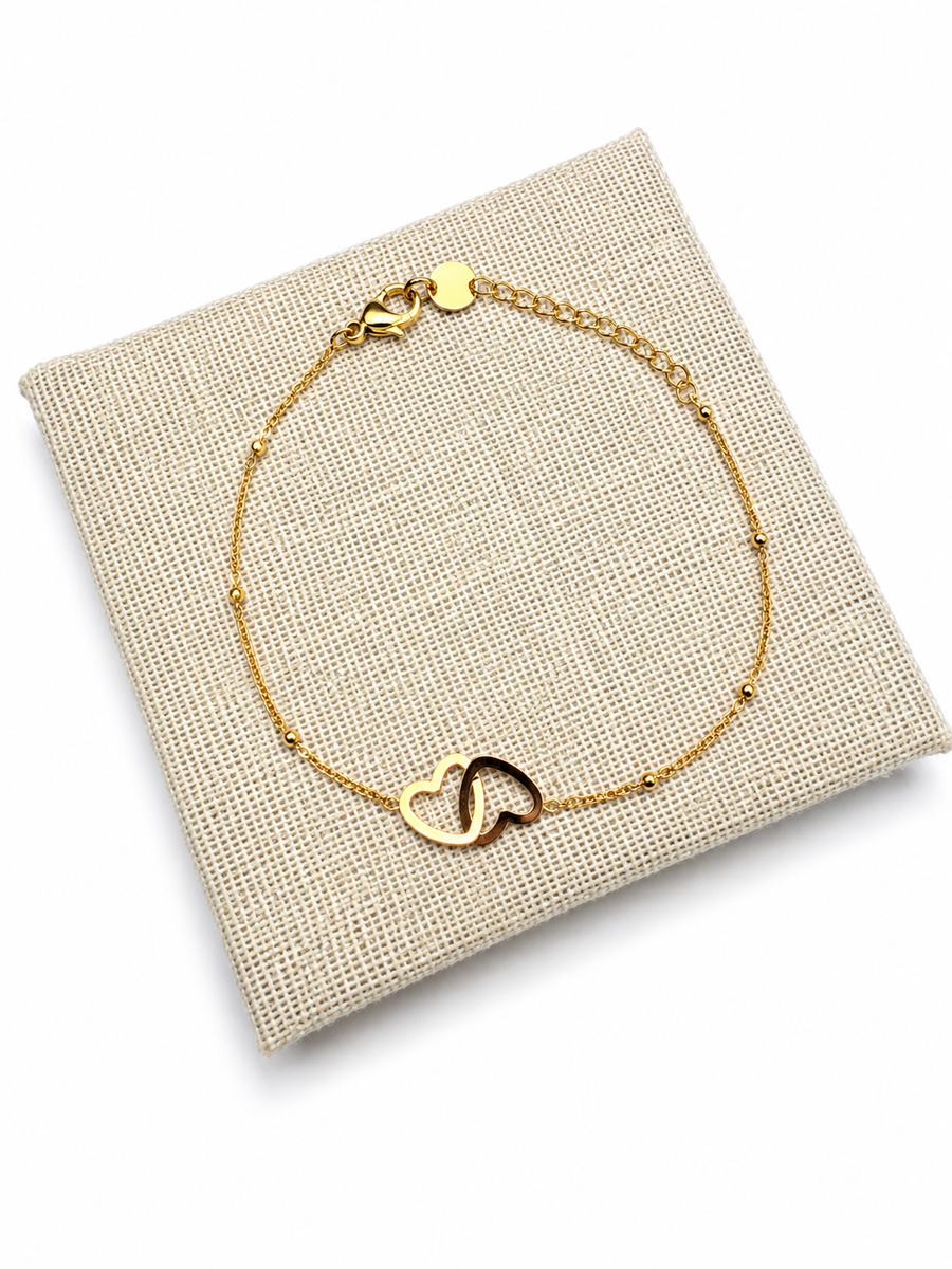 Bracelet fin cœurs dorés entrelacés en acier inoxydable – bijou femme élégant et intemporel
