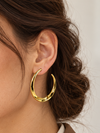 Boucles d’oreilles Créoles dorées ondulées en acier inoxydable – 4 cm