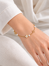 Fijne gouden roestvrijstalen damesarmband – trendy opengewerkte motieven