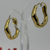 Boucles d’oreilles créoles ondulées dorées – Acier inoxydable.