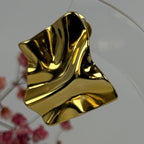 Oorklemmen met geplooid effect, goud- of zilverkleurig – Hypoallergeen roestvrij staal.