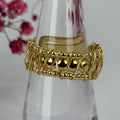 Verstellbarer Ring aus vergoldetem Edelstahl – filigranes, gedrehtes Design.