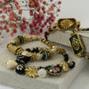 Armband aus grünem und schwarzem Kordel – Medaillon mit strahlendem Herz in Gold