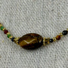 Collier multicolore – Œil de tigre & perles facettées dorées