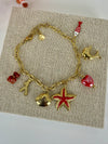 Bracelet charms marin rouge et coquillages en acier inoxydable doré ajustable