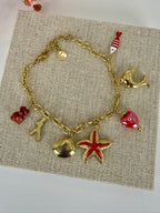 Bracelet charms marin rouge et coquillages en acier inoxydable doré ajustable