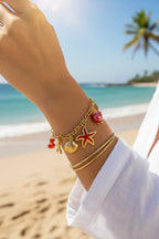 Bracelet charms marin rouge et coquillages en acier inoxydable doré ajustable