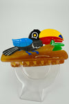 Pince à cheveux toucan en résine colorée – 10 cm