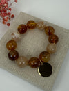 Bracelet perles marron & beige & médaillon doré – L’esprit bohème naturel