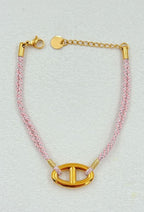Bracelet chaîne d’ancre en acier inoxydable doré et corde rose
