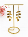Boucles d’oreilles pendantes feuilles martelées dorées – 6,5 cm